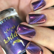 "Amethyst Spell" has a purple base with a lilac magnetic pigment and pink shimmer.

10ml Bottle