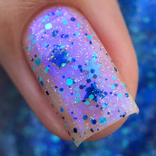 "Volcanic Ash" is a topper featuring a purple/blue shimmer and a mix of blue glitters, including star-shaped glitters.

10ml Bottles