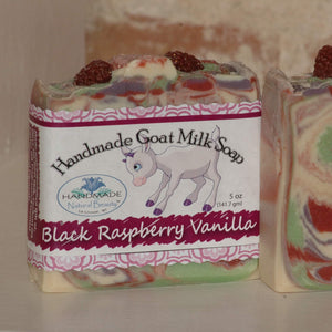 Handmade Natural Beauty presents the next seasonally-inspired luxurious Goat Milk Soaps in the "Seasonal” series. "Black Raspberry Vanilla” is a white, green, berry red, purple swirl design topped with raspberry glycerin soaps and sprinkled with cosmetic glitter.  The Black Raspberry Vanilla fragrance can be described as ripe black raspberries mixed with dark plum and warm vanilla. Simply delicious and juicy!   6oz Bar  25 Cap