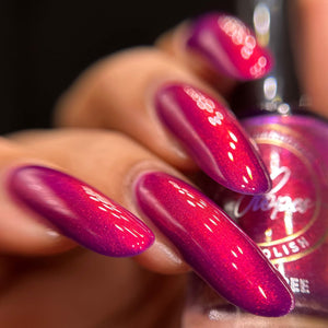 Indie Polish by Patty Lopes begins a new series inspired by Emily in Paris. First we have "Bouquet of Roses" which has a burgundy jelly base with aurora shimmer.