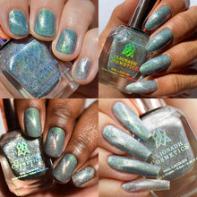 "Forest Spirit"is a sheer silver magnetic TOPPER that pulls to reveal Totoro’s magic of linear holographic pigment and green-aqua-violet shifting iridescent flakes. We recommend magnetizing it over Master of the Forest for a complimentary finish. It can be worn on its own magnetized or unmagnetized for a sheer ethereal effect.  *Some swatches are shown over Clionadh Comestics' June Polish "Master of the Forest."*  11.5ml