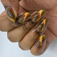 Penelope Luz continues their 'Goddess of Mythology' with a polish inspired by Hecate!

"Goddess of Magic" is an orange magnetic with gold glitter.