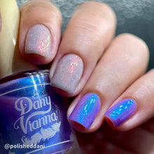 By Dany Vianna continues their 'Fruits Basket' series with polishes inspired by Hatori Sohma!

"Spring Will Come Again" has a sheer white crelly base, with pink aurora shimmer, white irregular glitters and light blue holographic reflective glitter.

"Year of the Dragon" has a sheer purple base with a strong blue aurora shimmer.