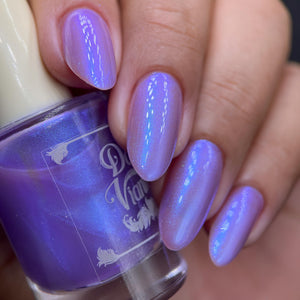 By Dany Vianna continues their 'Fruits Basket' series with a polish inspired by Hatori Sohma!

"Year of the Dragon" has a sheer purple base with a strong blue aurora shimmer.