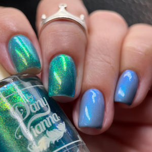 By Dany Vianna continues their 'Fruits Basket' series with polishes inspired by moments from the series!

"Always Connected" has a grey jelly base with a blue aurora shimmer.

"First Sunrise Together" has a sheer blue base with a sparkling large particle gold to green aurora shimmer.