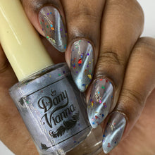 "Rainbow Connection" has a light blue magnetic effect with a mix of rainbow metallic shreds. The bag has a mini file keychan.

11ml Bottle