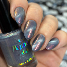 "Veil of Embers has a smoky blue base with orange/gold shimmer and a silver magnetic pigment.

150 Cap