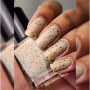 Red Eyed Lacquer continues their 'Iconic Movie Quotes' series with a polish inspired by Selena!  "Anything For Selenas" is a pale orange with orange shifting shimmer and black flakes!  12ml Bottles