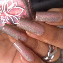 "Those Are My Night Peanuts" has a creamy light brown base, with flashes of pink and coral aurora shimmer, kissed with linear holo.

15ml Bottle