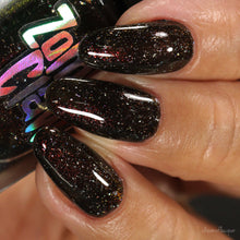 "Meowentino" has a black jelly base with red-gold shimmer and holo flakies.

13ml Bottle

100 Cap