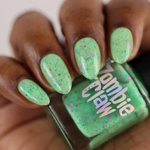 "Zombie Pinup" has a bright mint green base with purple-green flakies and green/purple glitters.

13ml Bottle