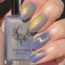“Magic Mirror" is a light indigo-grey with gold-green magnetic, and blue iridescent shimmers.

15ml Bottle