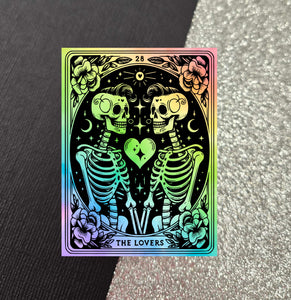 Golly Oodelally Designs is incredibly excited to celebrate Pride month and offers "The Lovers" phone grip. Acrylic topper measures 2.25 inches wide by 3 inches tall.  Phone grip will be black. While sturdy, these are breakable if dropped so please handle with love.&nbsp;  This phone grip top is not swappable to help keep costs down, and due to thickness, this phone grip will likely NOT fit a car phone holder.