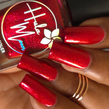 "Reign of the Damned" starts with a dark red base that evokes bloodthirsty elegance of a vampire’s reign. While there is no holo, there is a large particle shimmer that bounces and reflects light like a holo without the varied color shifts. It’s rich finish and sparkle make it a bold choice for a Hellaween manicure.

15ml Bottle