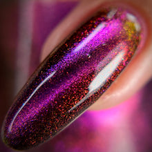 Sassy Sauce Polish continues their 'Shoe' inspired series!

"Shiftcraft" is a purple/copper/gold/green multi chrome magnetic. When magnetized, it will show off a multicolored cat eye and leave a reddish shimmer in the black background!