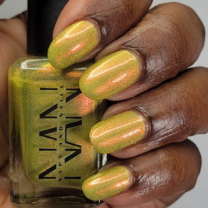 Naps and Nails continues their 'Summer Scares' series with a polish inspired by Jaws!  "Yum Yum...Yellow" is a yellow based holo polish has shifting shimmer of golden orange and pinkish red.  15ml Bottle