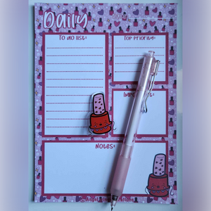 The notepad measures 5"×7" and it has 30 pages. The pen has a red nail polish charm with a hearts garland. It's a black fine point gel ink.

30 Cap