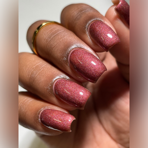 Pampered Polishes continues their 'Halloween' series!

"Lady &amp; The Vamp" is a brick red with a subtle gold shimmer and a linear holographic effect. This dries intentionally matte to give a velvet finish.