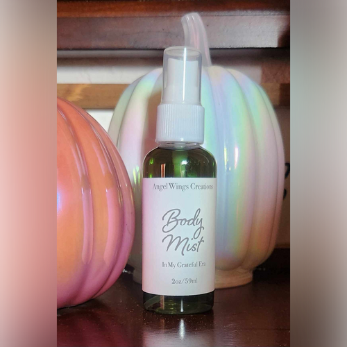 Angel Wings Creations continues their 'Eras' series!

This is a perfect sized (2oz.) Body Spray for your bag, travel carry-on, bathroom, locker and or office desk. These are not only conveniently packaged for portability, they are beautifully scented in earthy smell of a pumpkin patch combined with the warmth of cinnamon, nutmeg and clove, along with soothing fir and cedarwood.