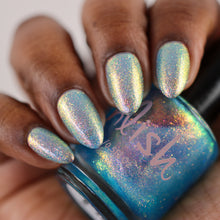 "Serotonin" is a bright ocean blue jelly packed with glowing pink/gold/green shimmer.

15ml Bottle&nbsp;