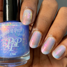 "Sugar Spun Magic" has a light blue base with a pink shimmer and pink shifting irridescent flakes.

15ml Bottle