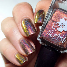 "Raised By Wolves" has a linear holo base with a red to gold multi-chrome shimmer, packed with red to gold to green crystal flakies.

15ml Bottle

100 Cap