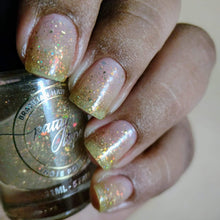 Indie Polish by Patty Lopes continues the series inspired by the Tim Burton Universe with "Scissorhands" which is a topper that has iridescent flakies, gold metallic midro flakies and gold holo micro glitters. 10ml bottle.  100 bottle cap
